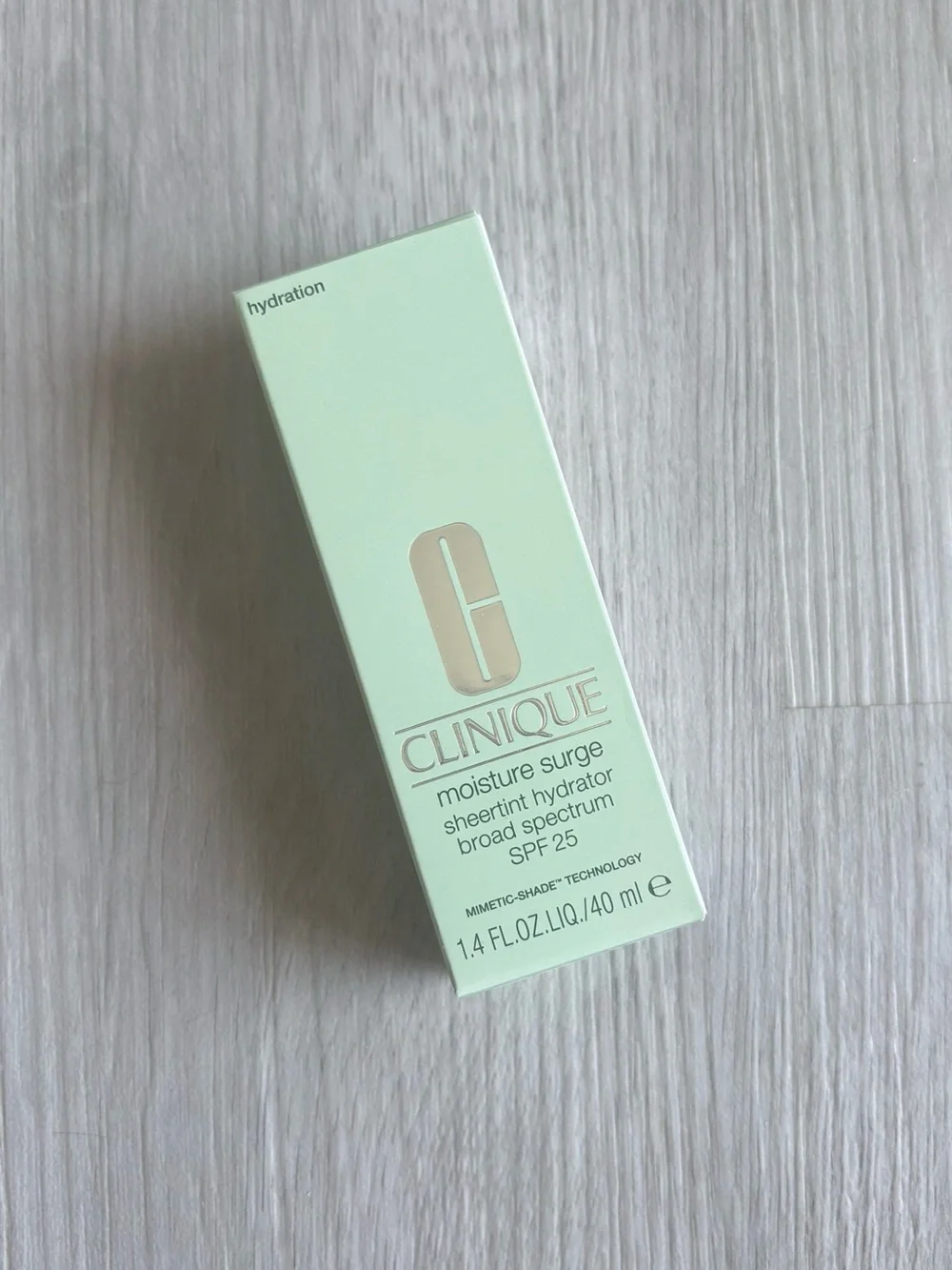 Clinique Moisture Surge Sheertint Hydrator - Picture 1 of 2